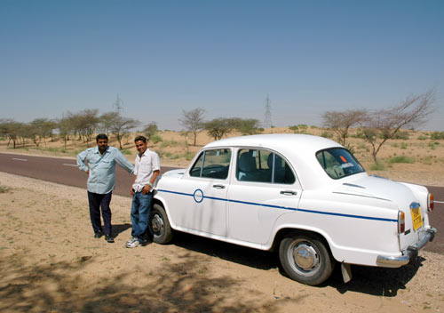 The Ambassador car, driver and Siddharth